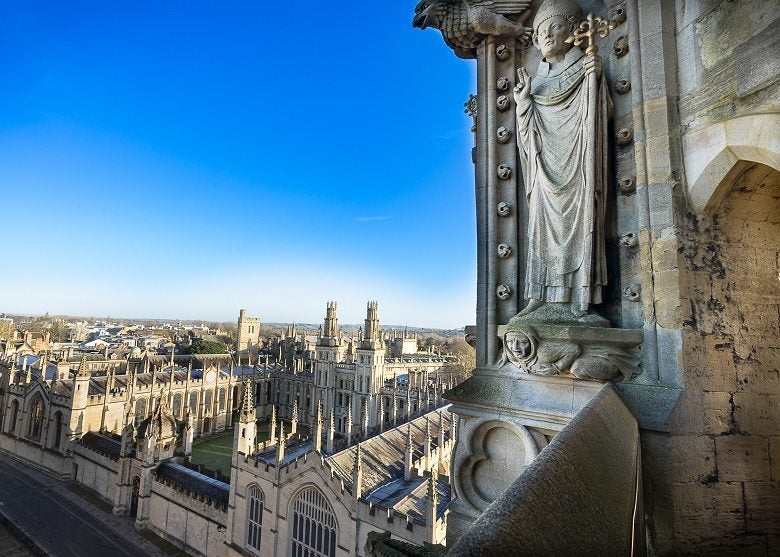 The part of tower of St Marys Church and All Souls College at the university of Oxford in the background. Oxford, England